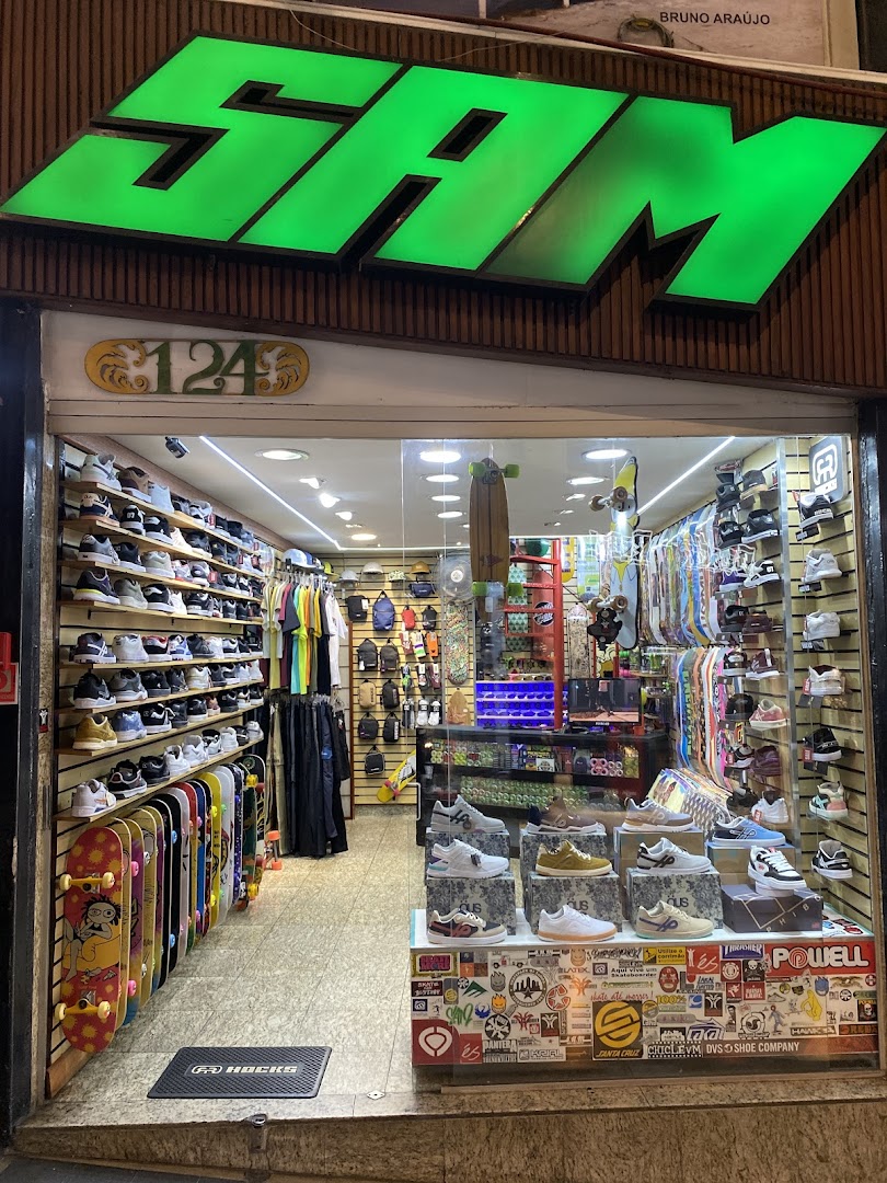 A skate shop entrance displaying skateboards, shoes, apparel, and accessories.