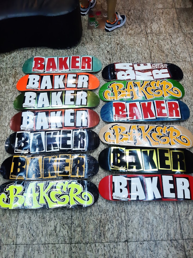 A collection of Baker skateboards with various colorful designs and logos.