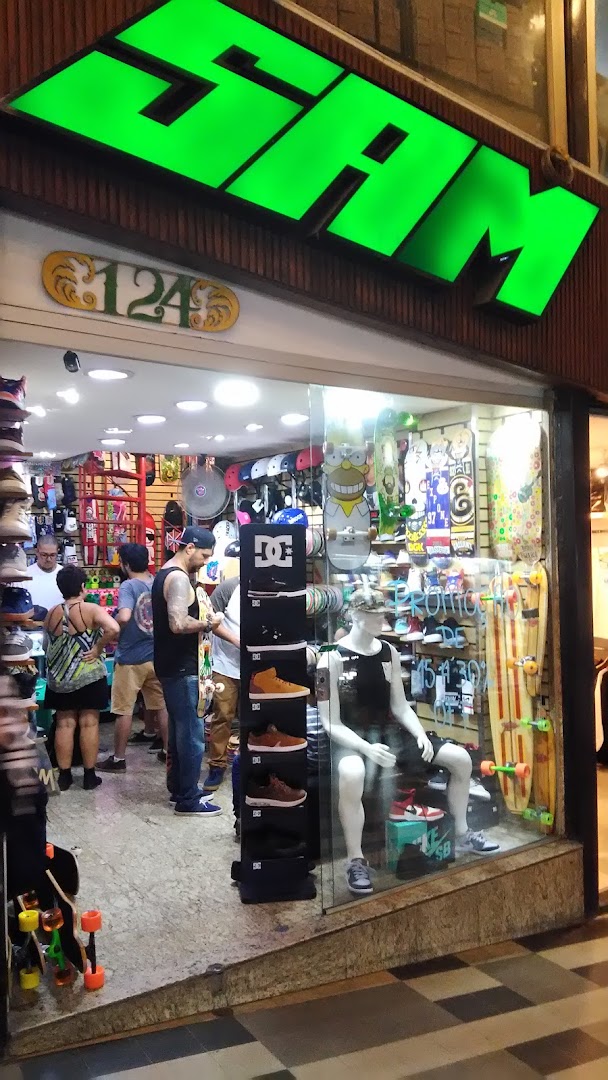 A skate shop with skateboards, shoes, and apparel displayed inside and outside.