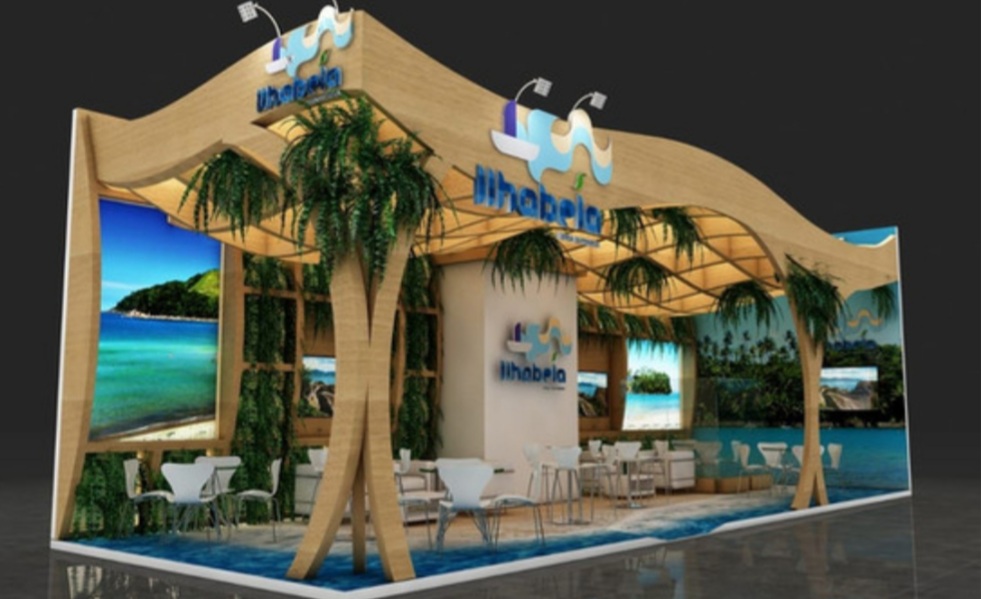 A tropical-themed exhibition booth with beach imagery and seating areas.