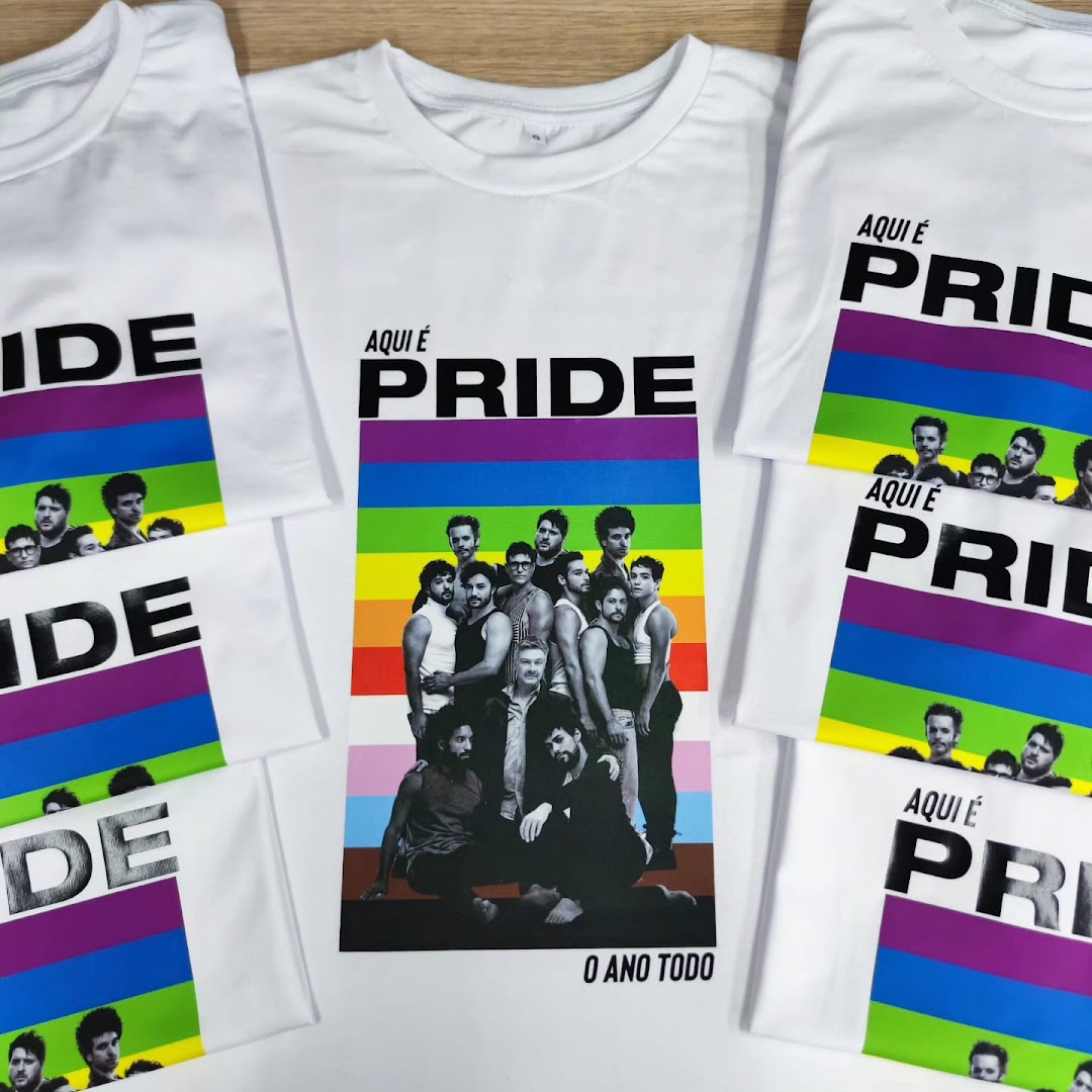 White t-shirts with a Pride-themed design featuring a group of men and rainbow stripes.