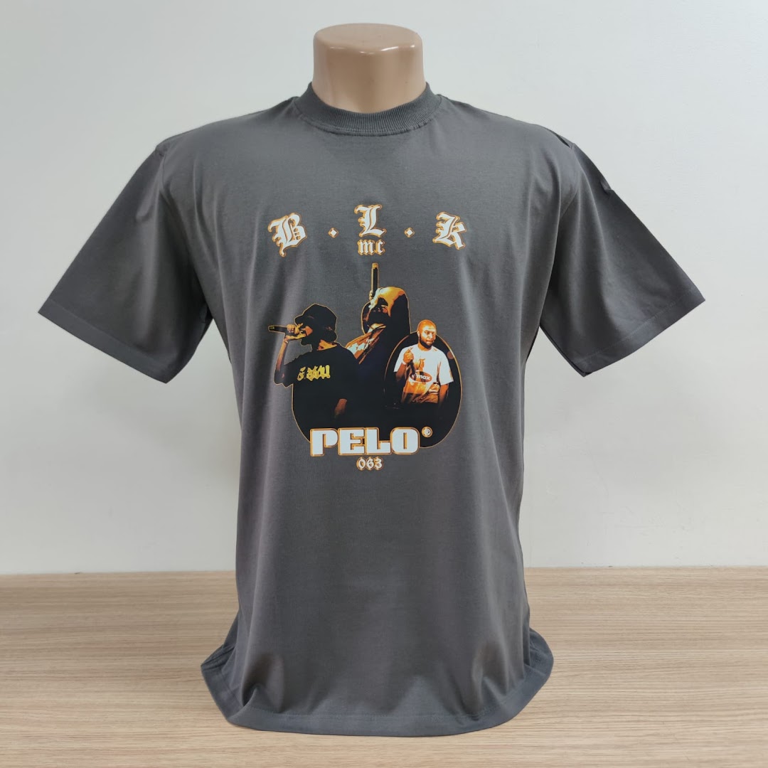 A grey t-shirt with a graphic print featuring musicians and the text 'B.L.K MC' and 'PELO 063'.