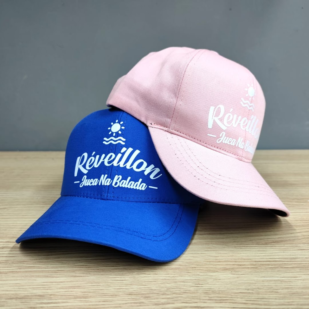 Two personalized caps, one blue and one pink, with white text and a sun graphic.