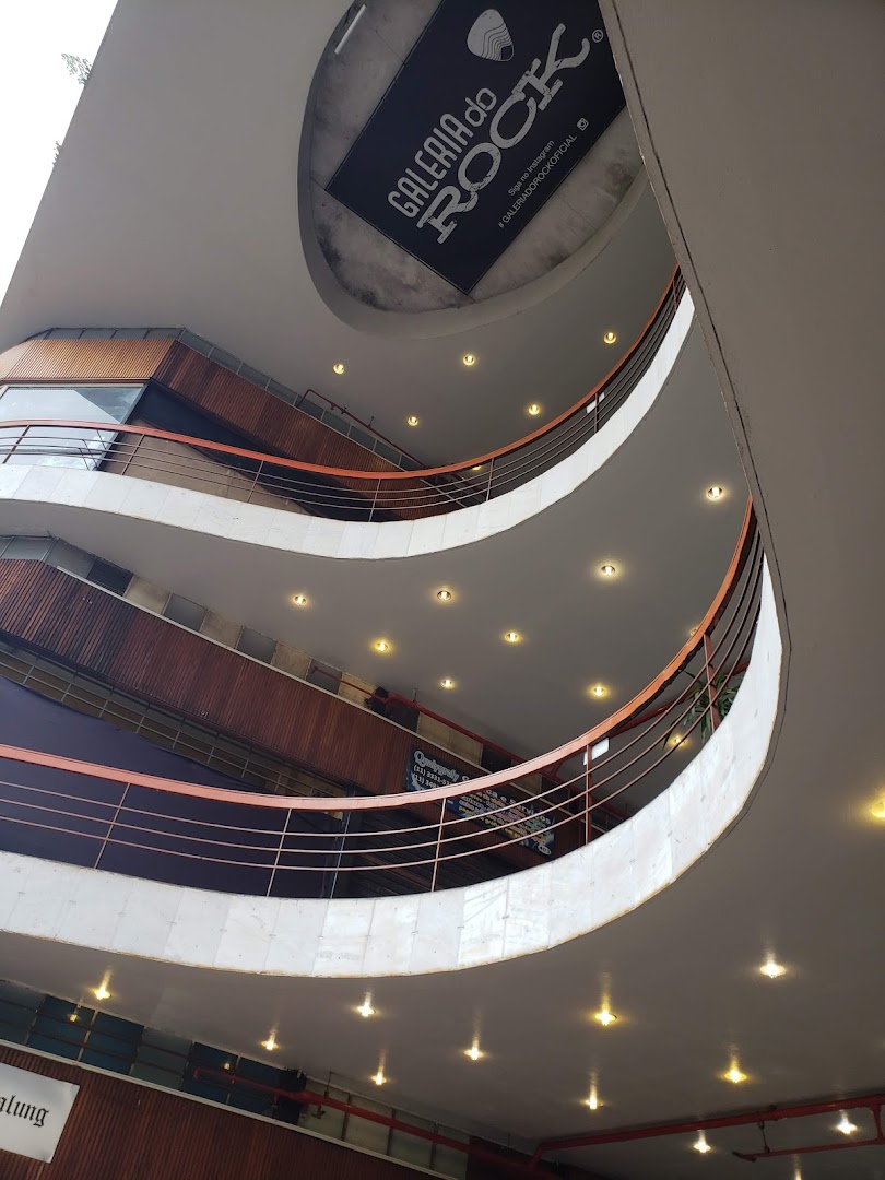 Interior view of a multi-level building with a sign for 'Galeria do Rock'.