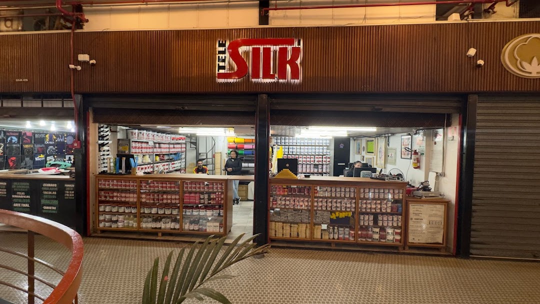 The Tele Silk shop front displays a wide selection of paints and supplies, with staff visible inside.