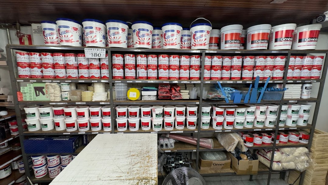 Shelves stocked with various paint cans and painting supplies.