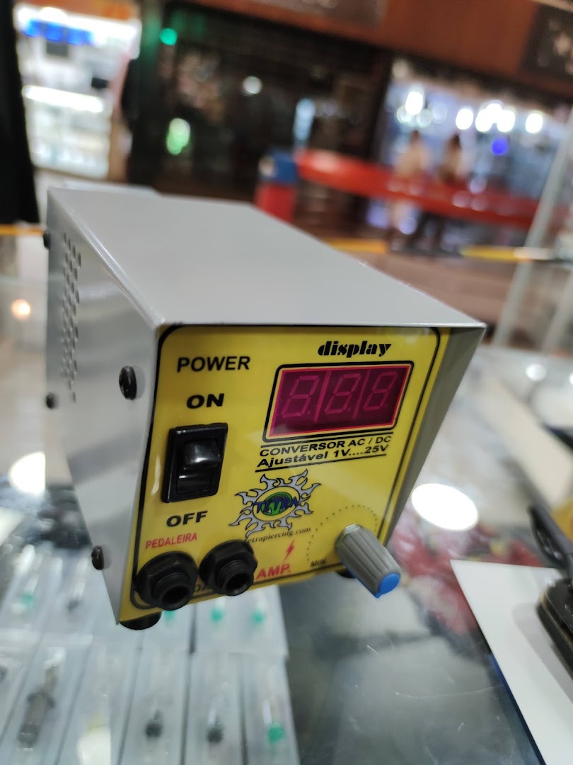 A close-up of a power supply unit with a digital display and controls.
