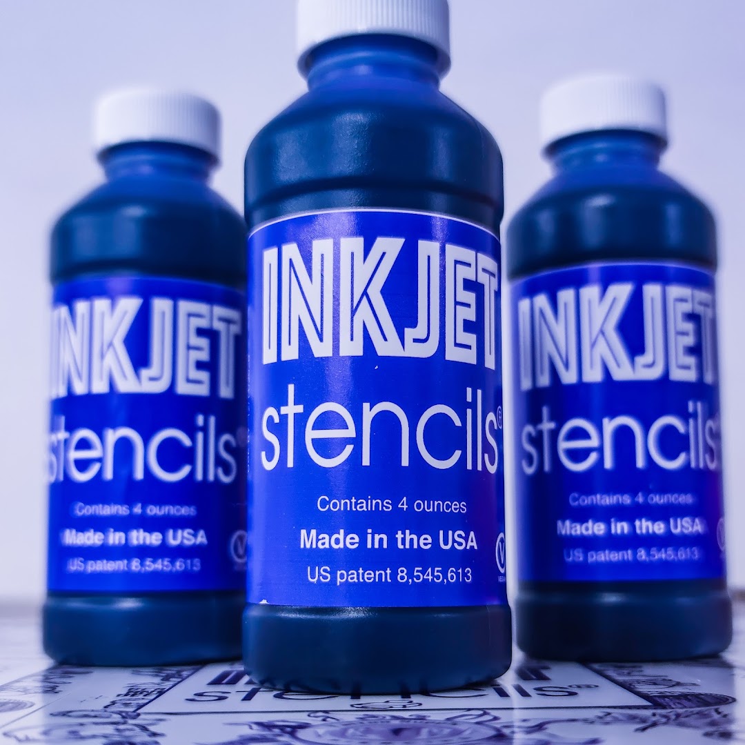 Three bottles of blue Inkjet Stencils liquid, made in the USA.