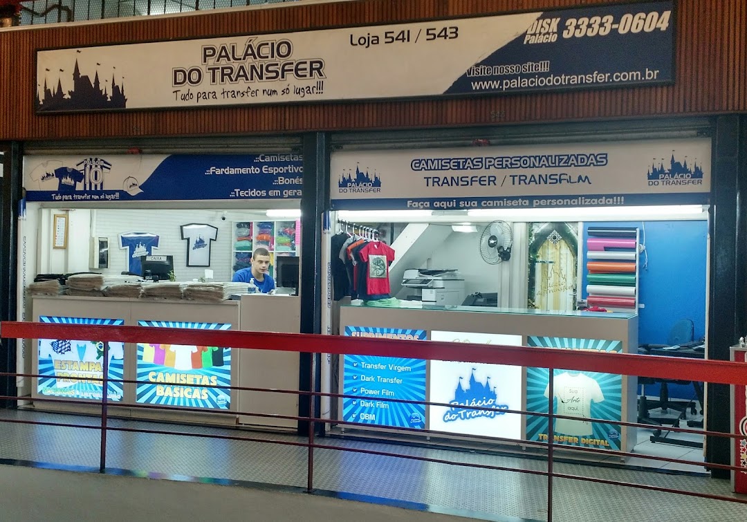 Shop front for 'Transfer Palace' offering custom t-shirts and transfer services.