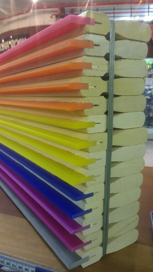 A stack of colorful plastic inserts for boots, bound together with a strap.