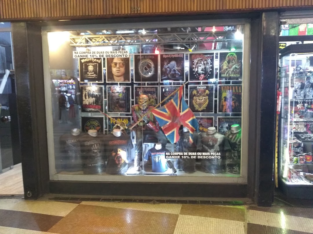 Vilela Boots shop window display featuring band posters, t-shirts, and a mannequin with a flag.