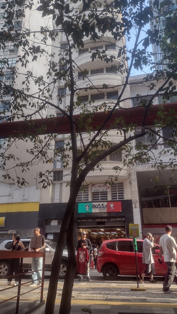 A street view of the "Your ID" shop entrance with people and cars passing by.